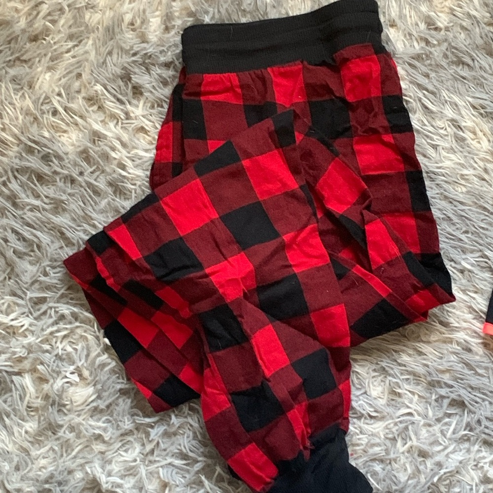 S stars above buffalo plaid pants